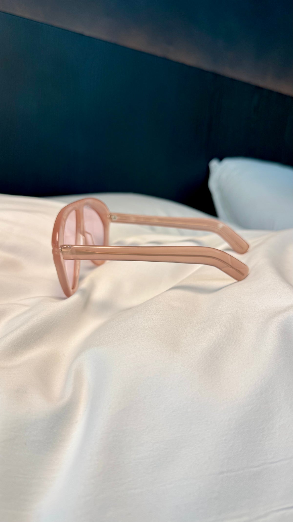 Handcrafted pink acetate luxury eyewear by ANNTURE with rose tinted lenses, oversized sculptural frame from the “…in the morning” collection