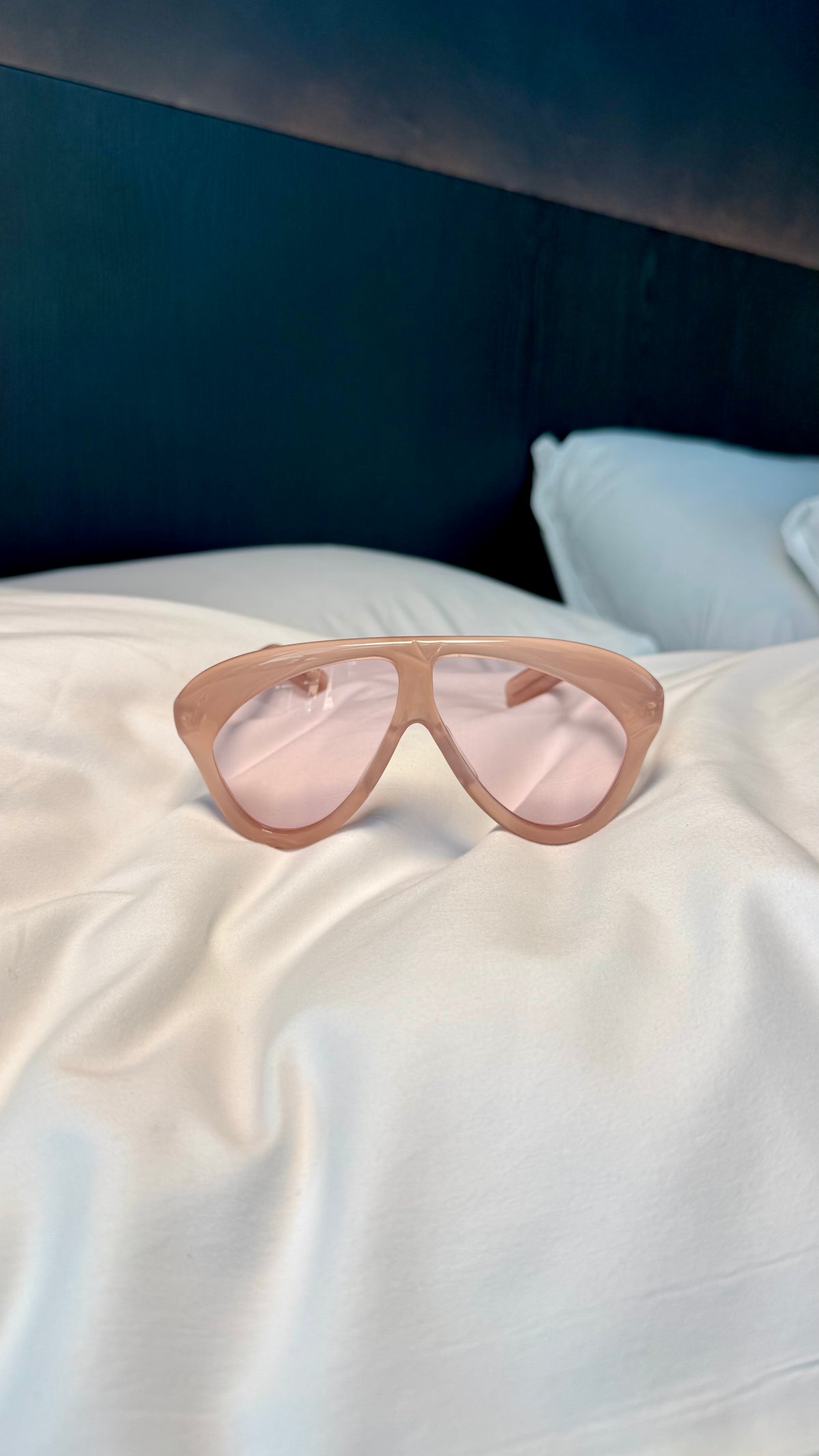 Handcrafted pink acetate luxury eyewear by ANNTURE with rose tinted lenses, oversized sculptural frame from the “…in the morning” collection