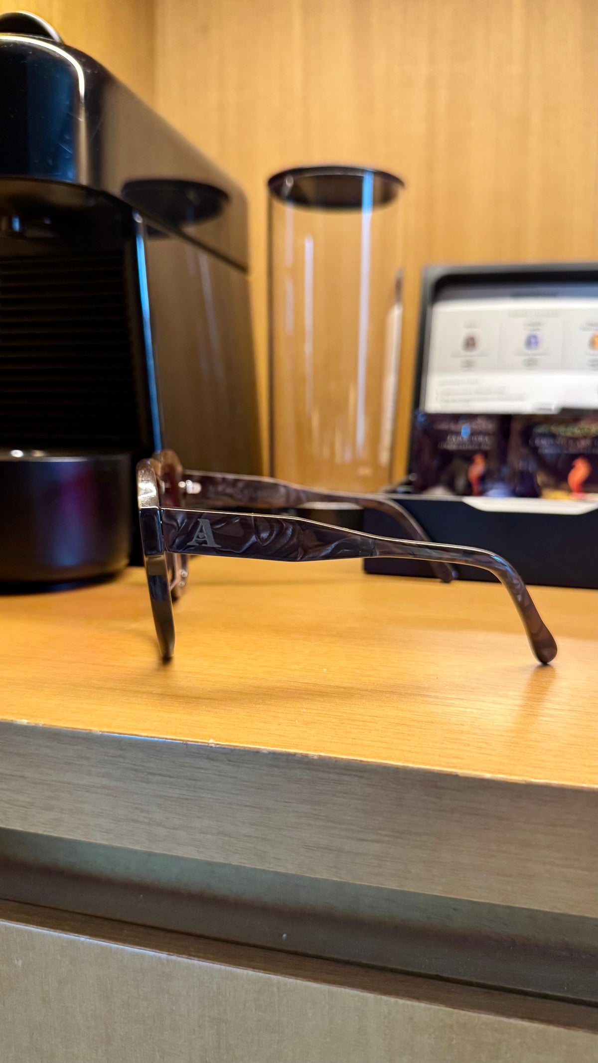 Handcrafted brown marbled acetate luxury eyewear by ANNTURE with red tinted lenses, sculptural frame from the “…in the morning” collection