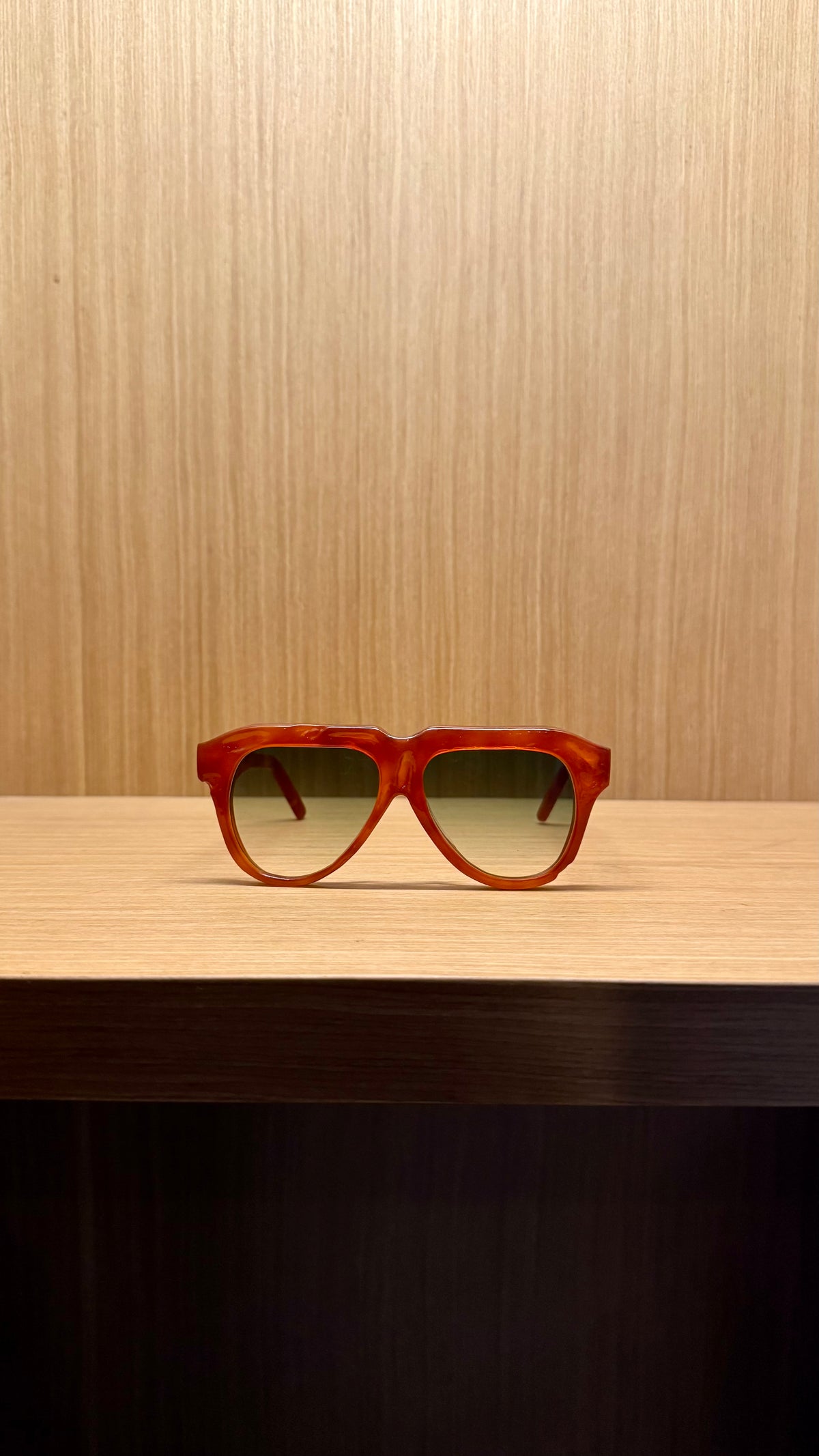 Handcrafted amber acetate luxury eyewear by ANNTURE with soft tinted lenses, warm sculptural frame from the “…in the morning” collection