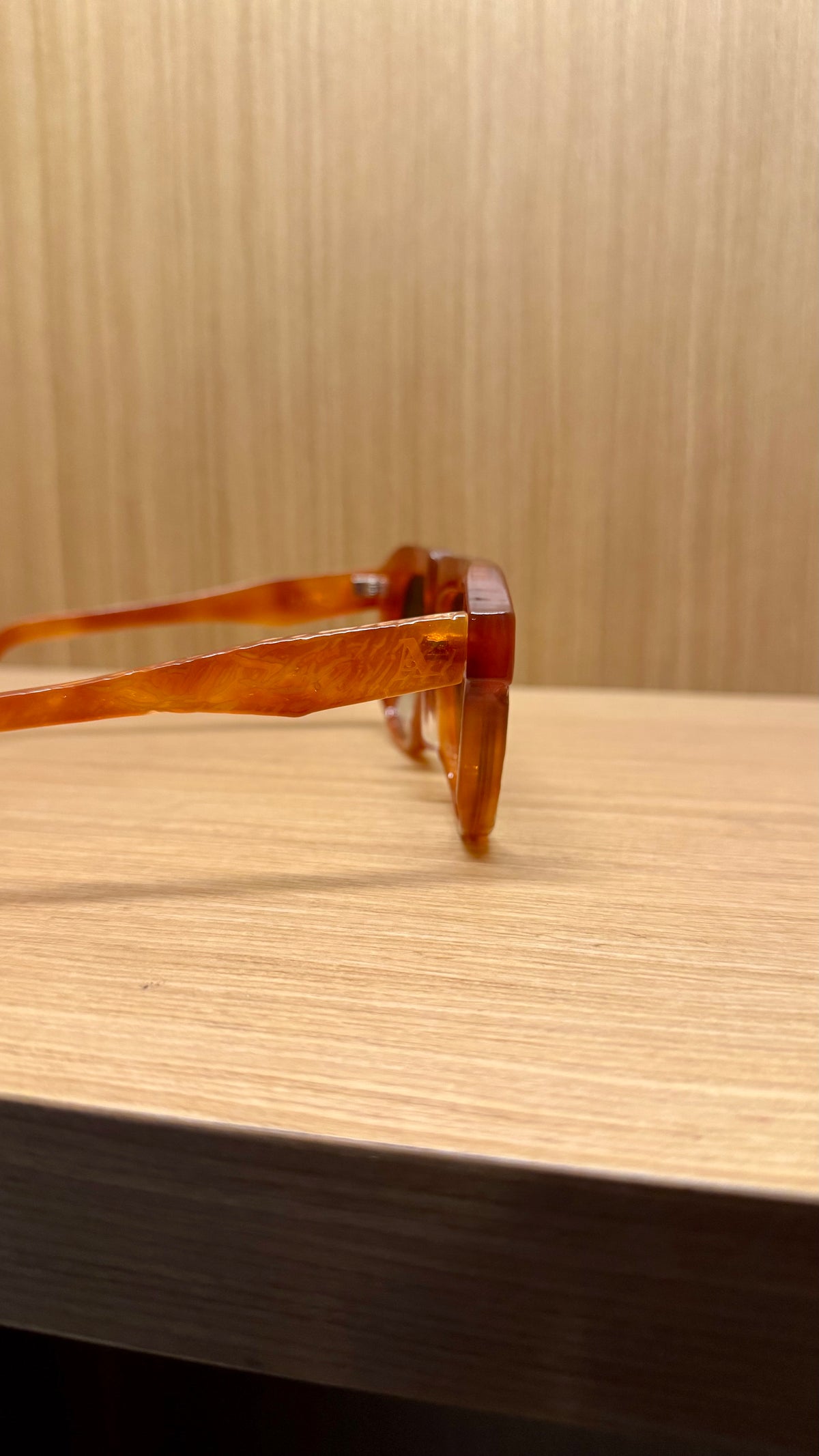Handcrafted amber acetate luxury eyewear by ANNTURE with soft tinted lenses, warm sculptural frame from the “…in the morning” collection