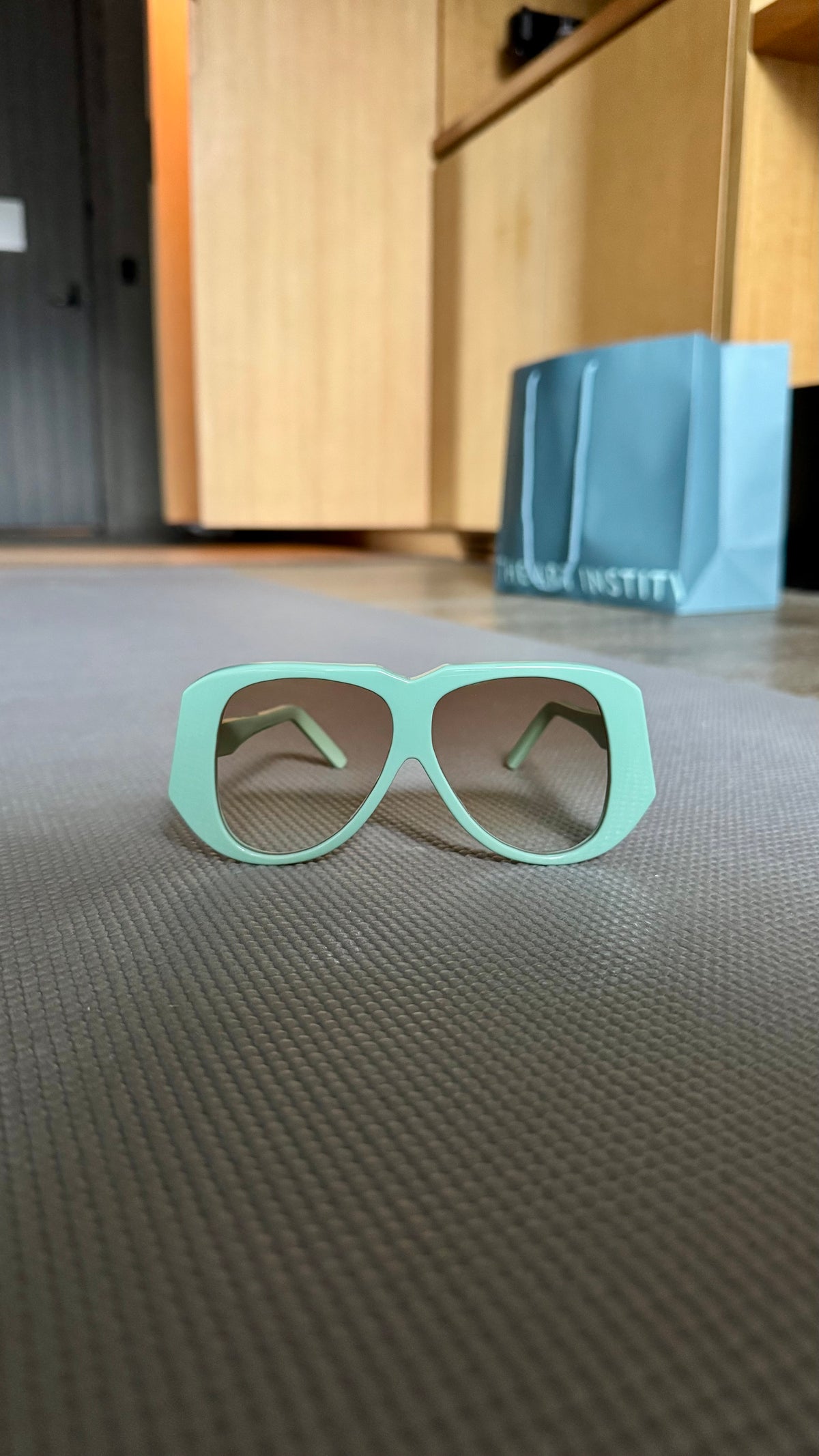 Handcrafted mint green acetate luxury eyewear by ANNTURE with subtle tinted lenses, sculptural frame from the “…in the morning” collection