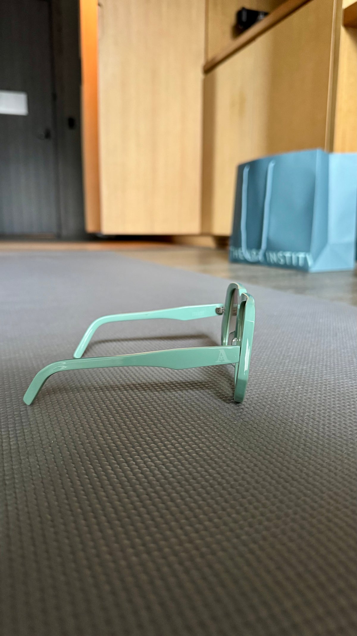 Handcrafted mint green acetate luxury eyewear by ANNTURE with subtle tinted lenses, sculptural frame from the “…in the morning” collection